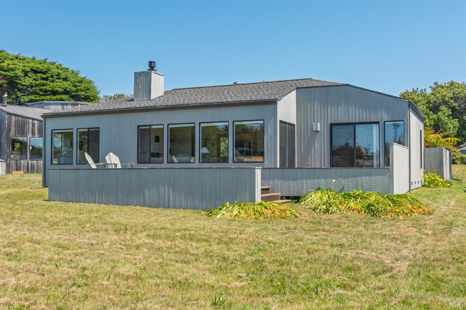 267 Sea Stack The Sea Ranch, CA 95497 - Photo 2 of 35 a front view of a house with a yard