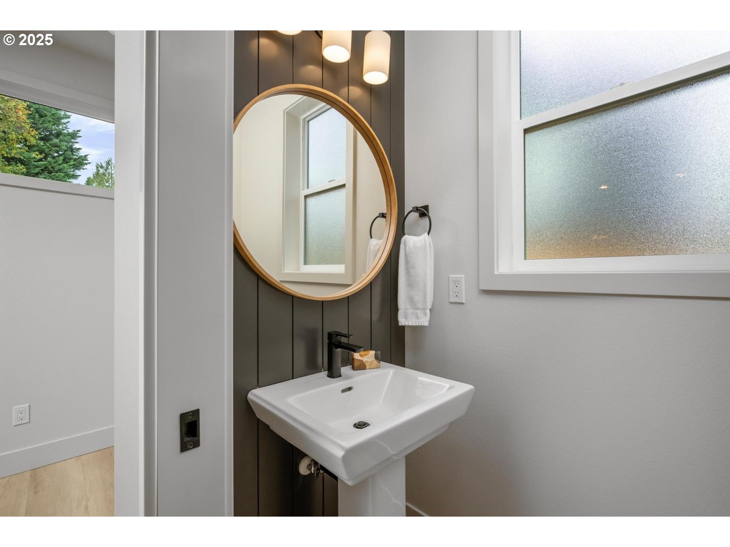 2624 North Kilpatrick Street Portland, OR 97217 - Photo 13 of 34 a bathroom with a sink a mirror and a window