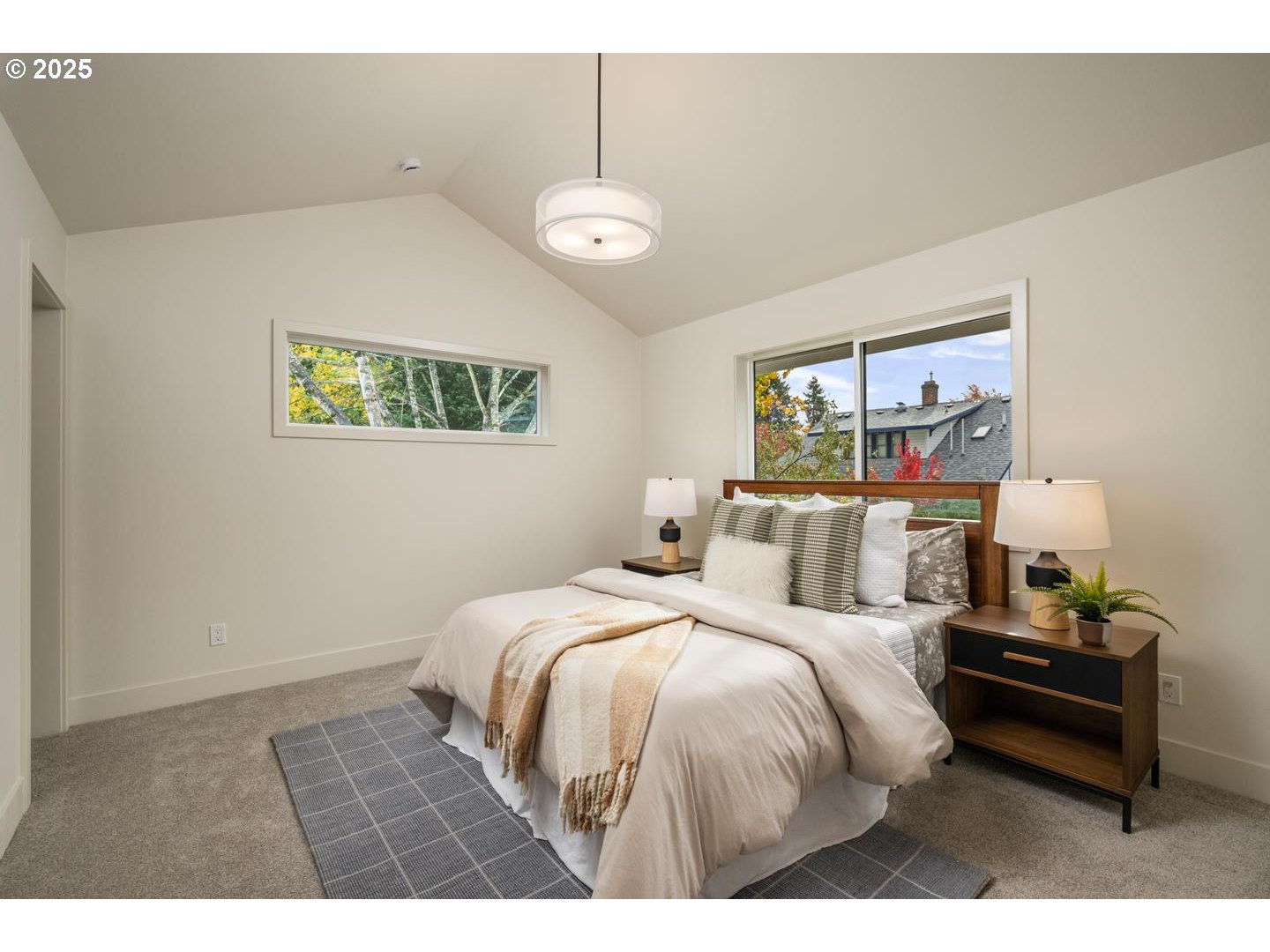 2624 North Kilpatrick Street Portland, OR 97217 - Photo 19 of 34 a bedroom with a bed and a chandelier