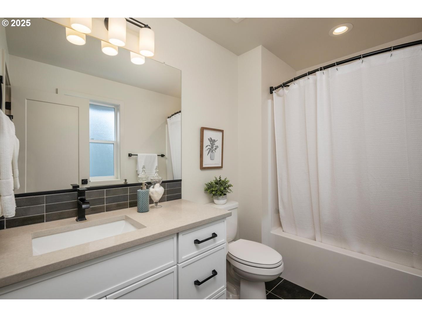 2624 North Kilpatrick Street Portland, OR 97217 - Photo 23 of 34 a bathroom with a sink a toilet and a large mirror