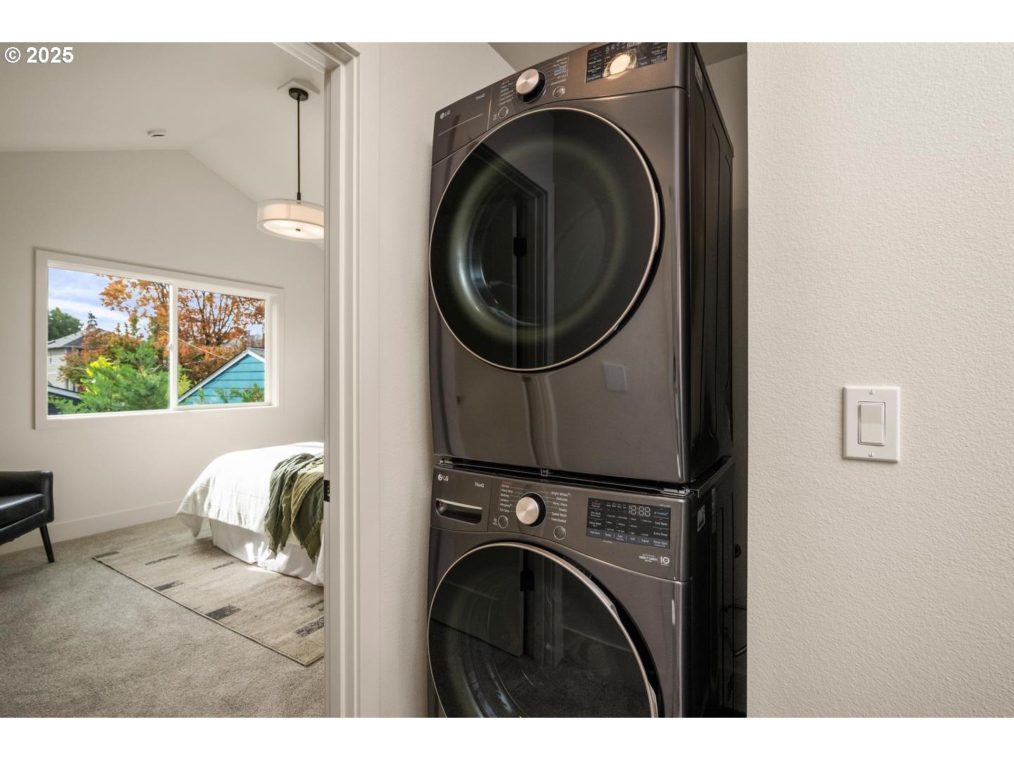 2624 North Kilpatrick Street Portland, OR 97217 - Photo 24 of 34 a view of a bedroom with washer and dryer