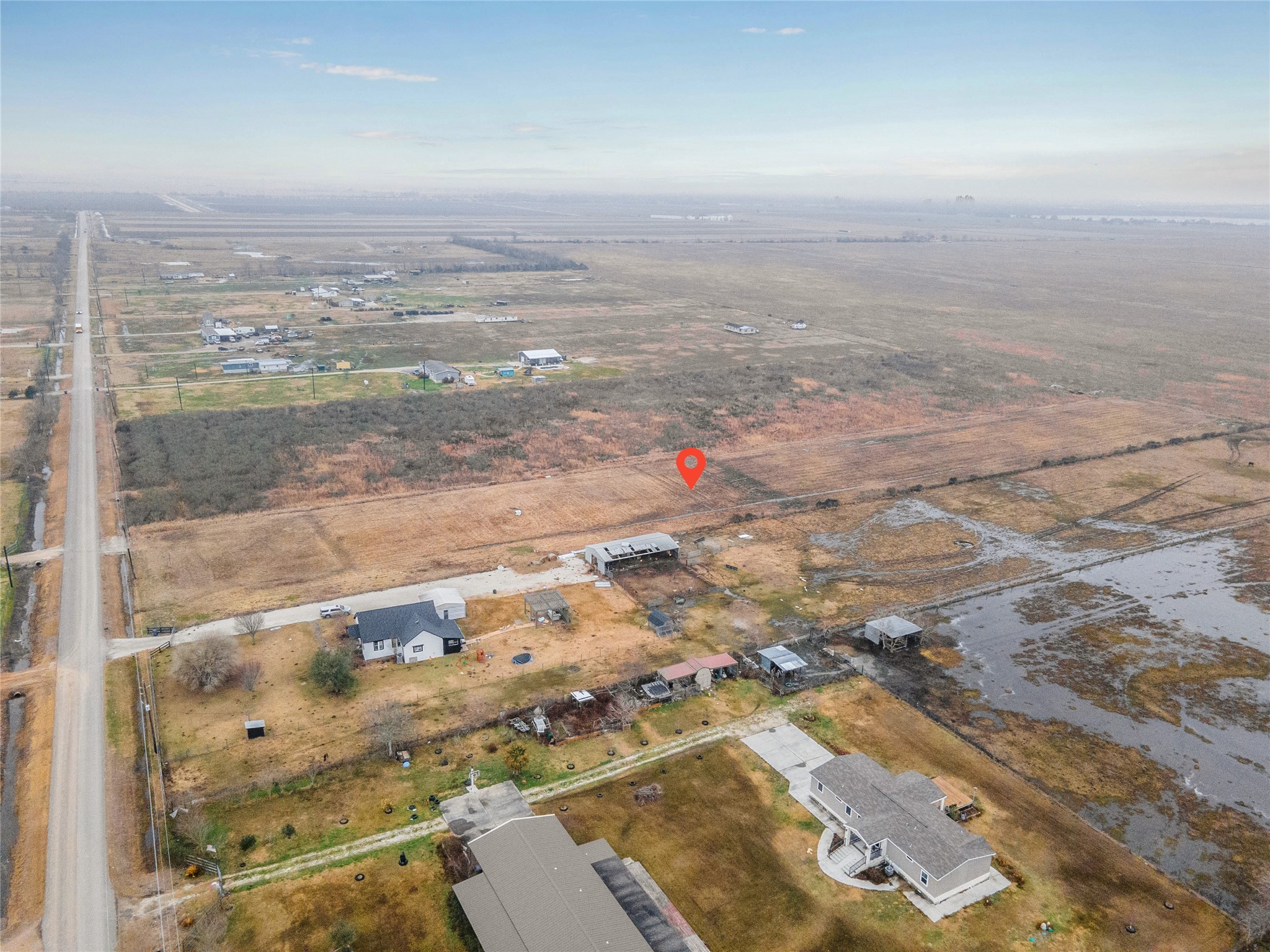 1813 County Road 212 Angleton, TX 77515 - Photo 9 of 12 an aerial view of residential houses with outdoor space