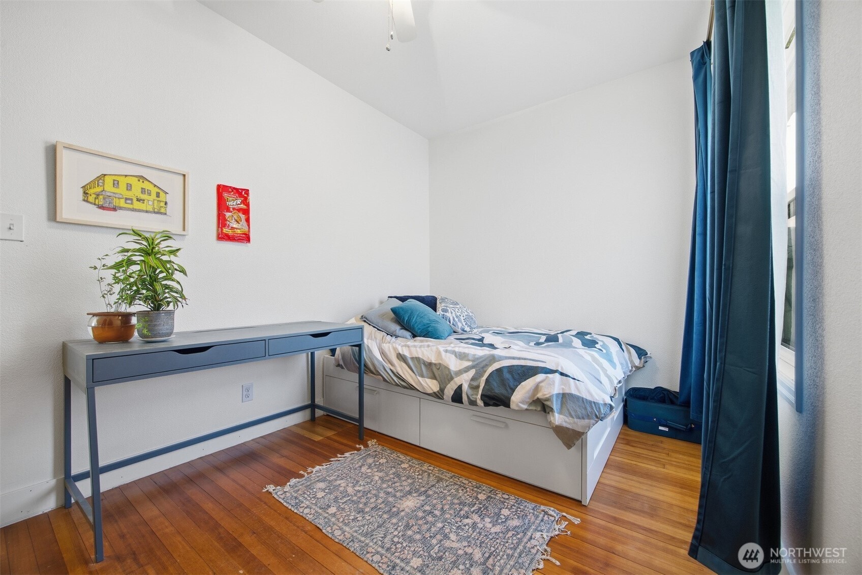 1205 Humboldt Street Bellingham, WA 98225 - Photo 22 of 40 a bed sitting in a bedroom next to a window