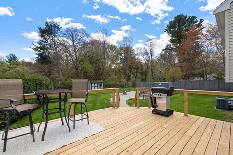 a view of a table and chairs on the roof deck
