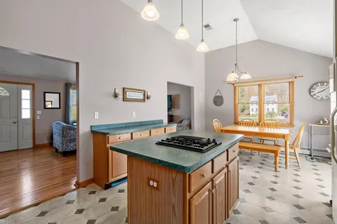 a kitchen with a stove a sink and a refrigerator
