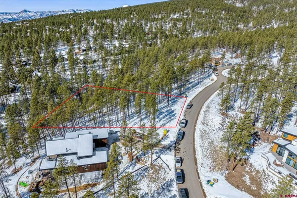 a view of a house with a mountain in the background