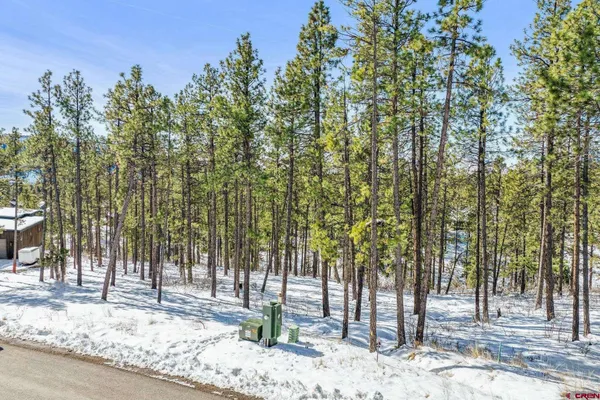 a view of a street with a building in the background