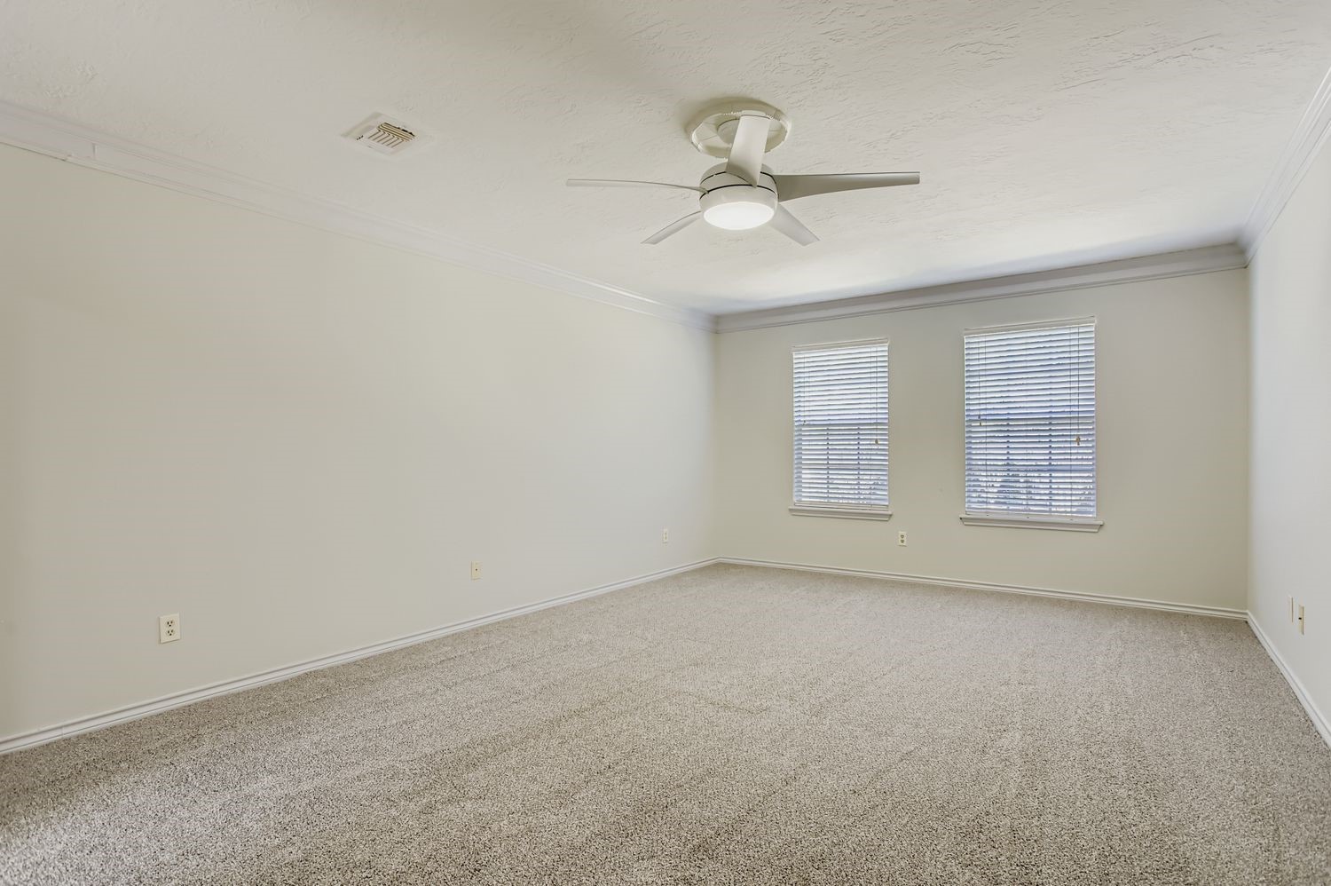 8518 Rebawood Drive Humble, TX 77346 - Photo 15 of 36 Discover the tranquility of the oversized primary bedroom, ideally positioned at the top of the stairs with a charming view overlooking the front of the house.
