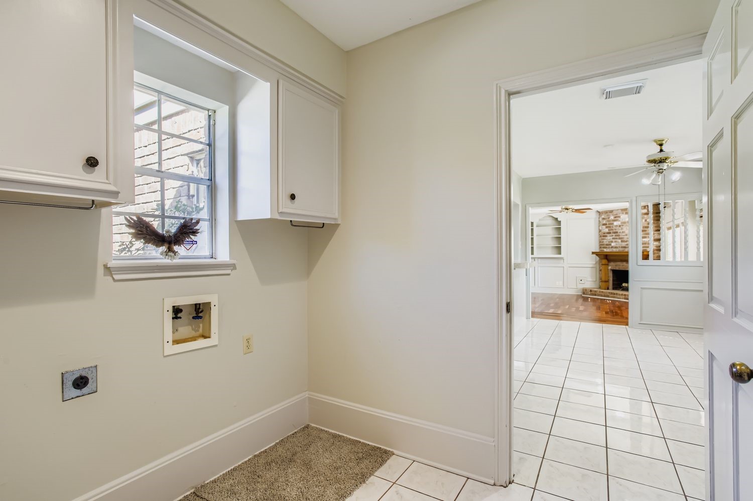 8518 Rebawood Drive Humble, TX 77346 - Photo 24 of 36 Bright and airy, this separate laundry room is conveniently located between the kitchen and garage.