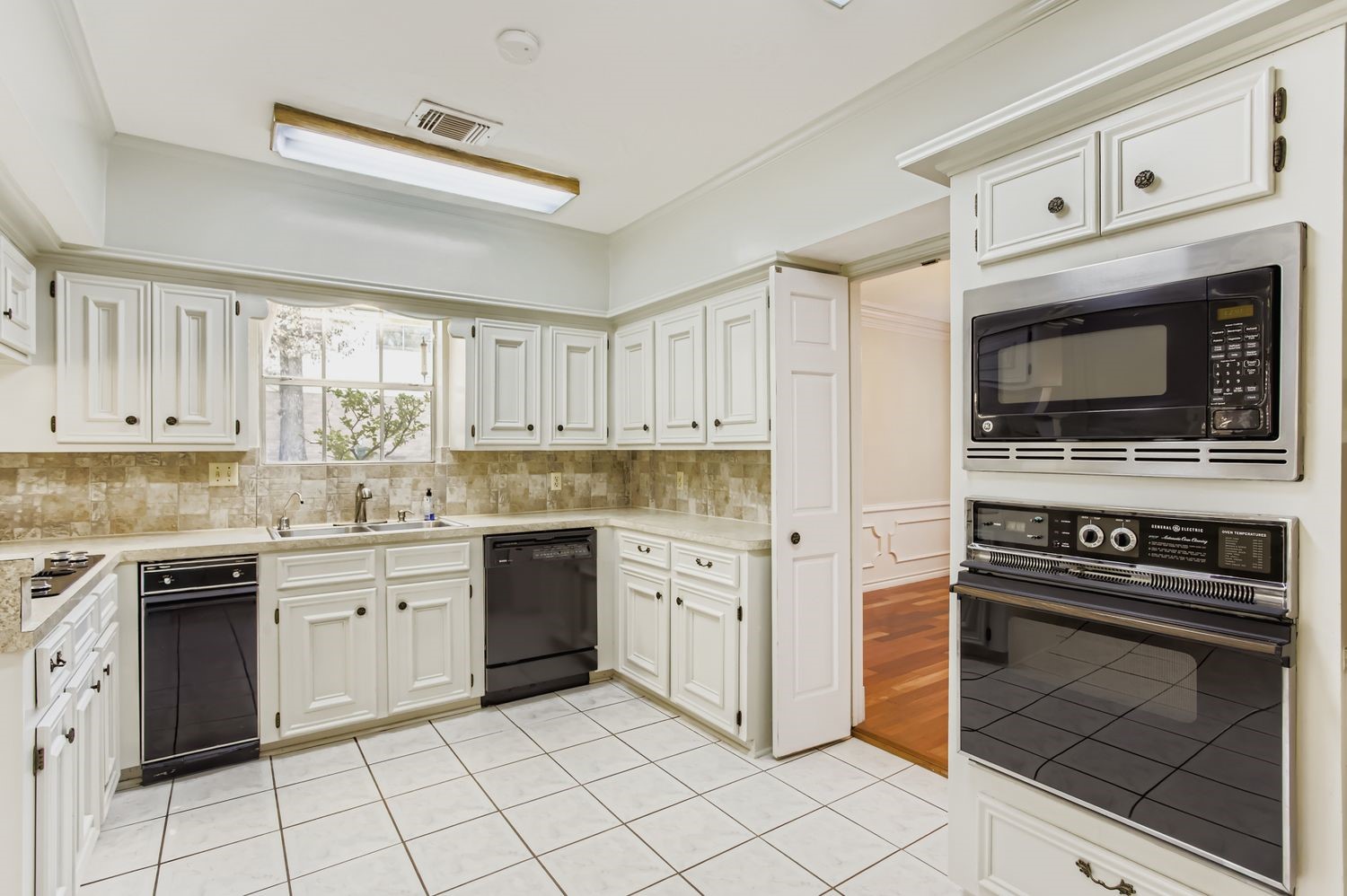 8518 Rebawood Drive Humble, TX 77346 - Photo 9 of 36 This bright kitchen, flooded by both natural and artificial light, makes meal prep a breeze.