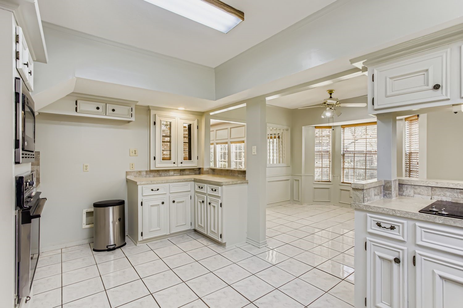 8518 Rebawood Drive Humble, TX 77346 - Photo 10 of 36 The kitchen seamlessly flows into a bright breakfast area, perfect for gathering around a spacious table.