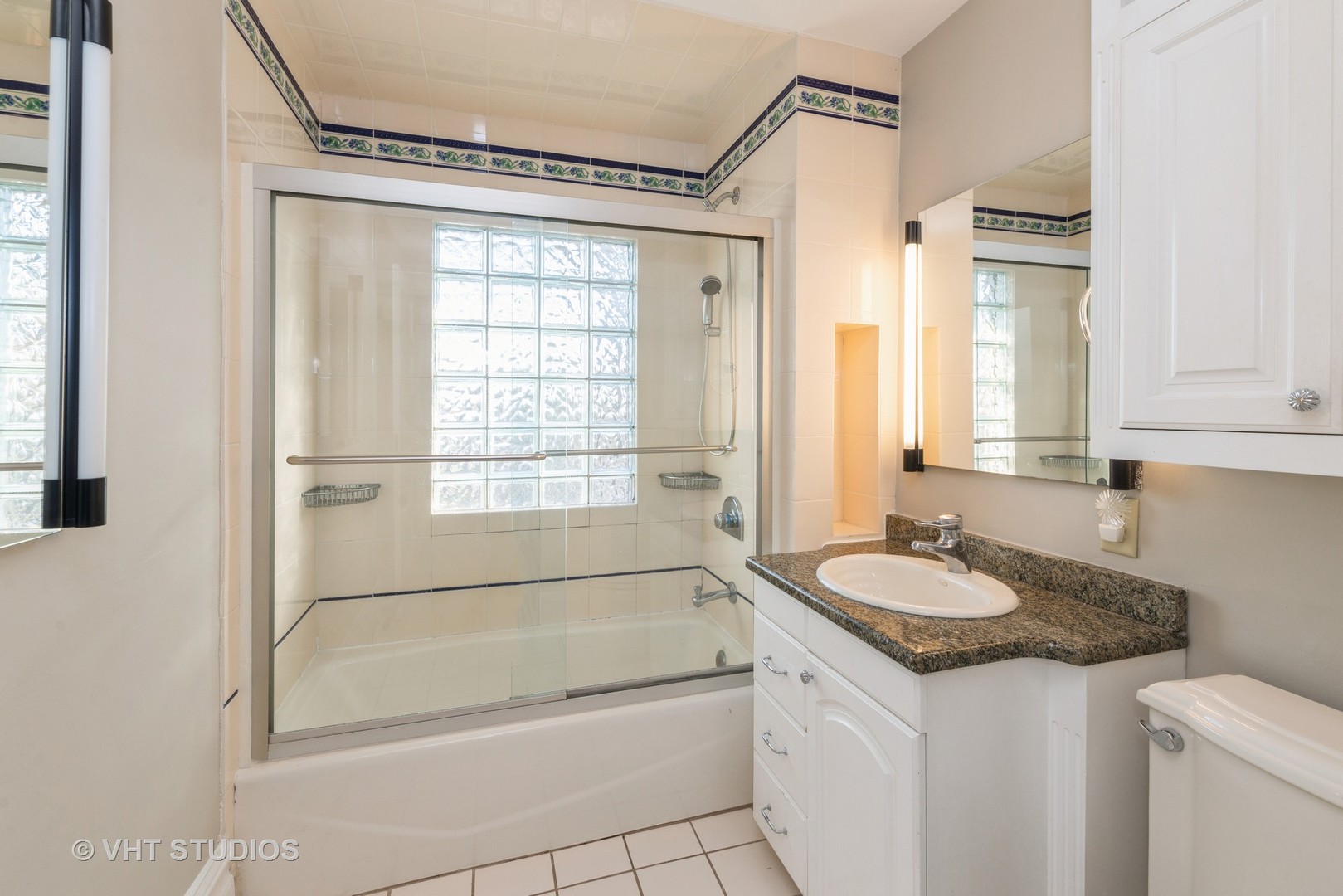 2N100 Brundige Road Elburn, IL 60119 - Photo 21 of 34 a bathroom with a granite countertop sink mirror vanity and a bathtub