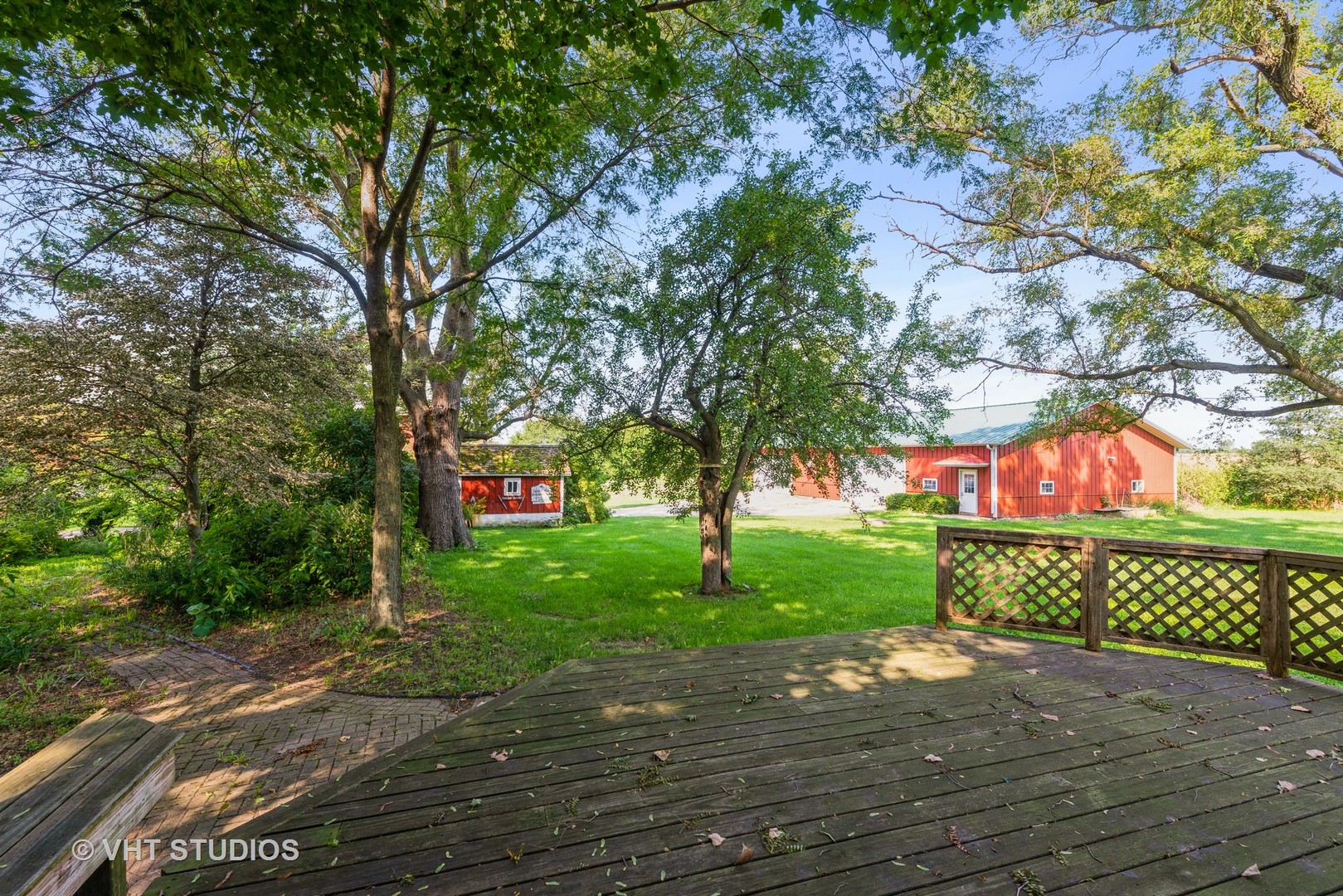 2N100 Brundige Road Elburn, IL 60119 - Photo 6 of 34 a street view with a large trees