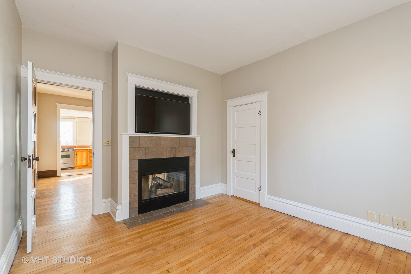 2N100 Brundige Road Elburn, IL 60119 - Photo 10 of 34 a view of an empty room with wooden floor fireplace and a window