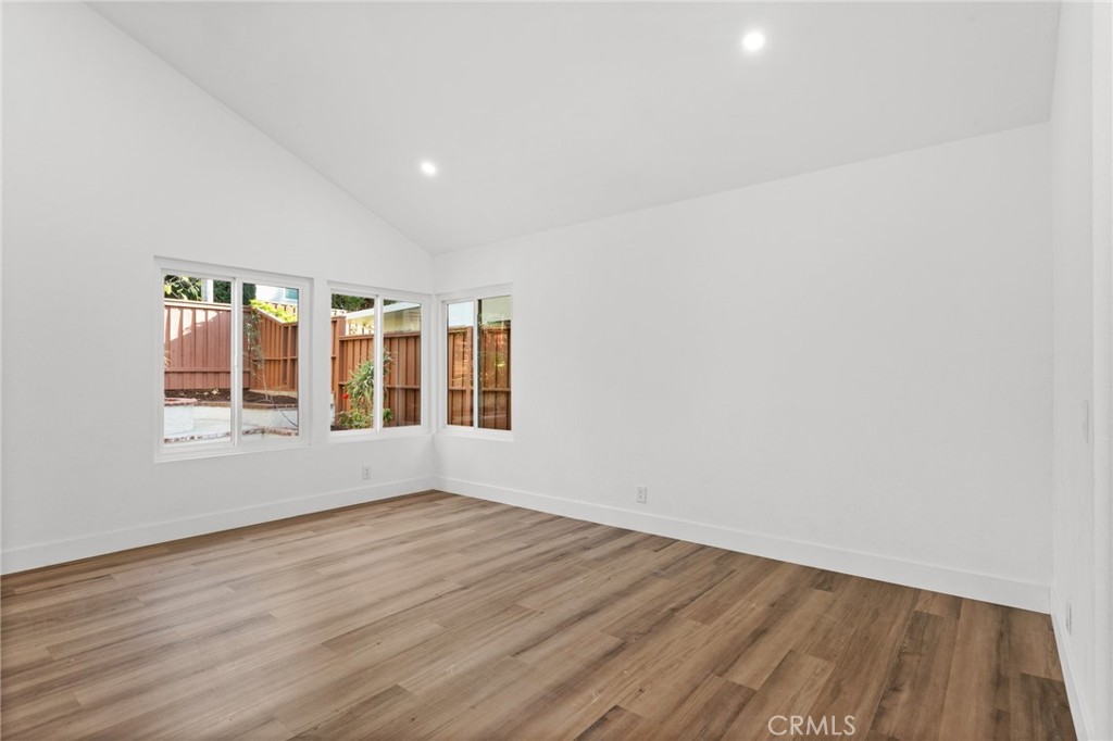 16 Encina Irvine, CA 92620 - Photo 12 of 37 an empty room with wooden floor and windows