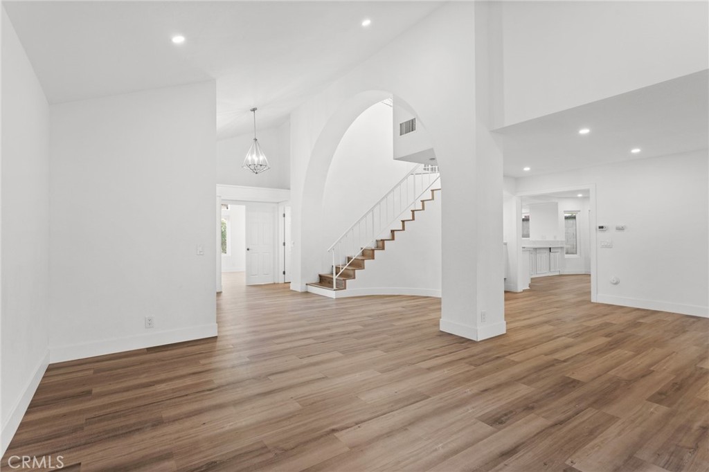 16 Encina Irvine, CA 92620 - Photo 13 of 37 a view of an empty room with wooden floor and stairs