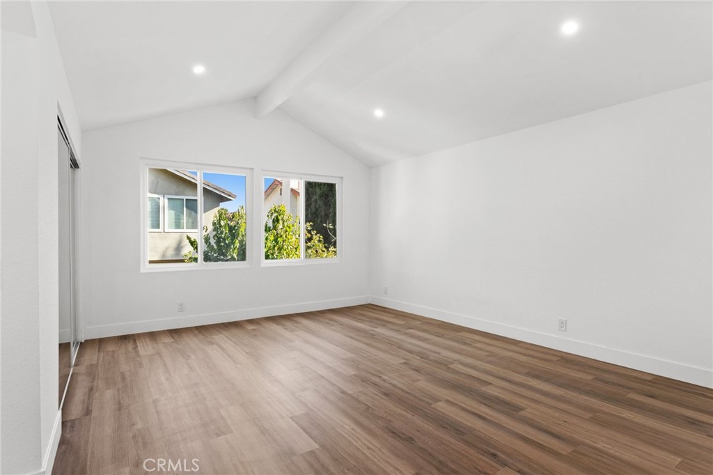 16 Encina Irvine, CA 92620 - Photo 17 of 37 an empty room with wooden floor and window