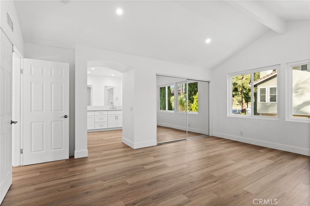 16 Encina Irvine, CA 92620 - Photo 18 of 37 a view of an empty room with window and wooden floor