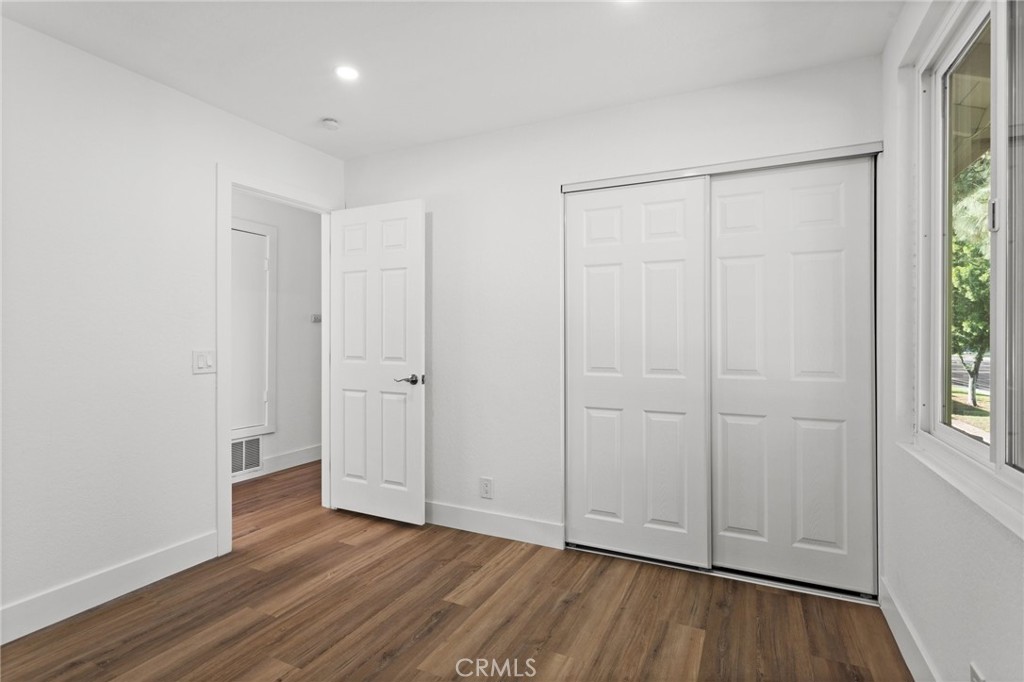 16 Encina Irvine, CA 92620 - Photo 23 of 37 an empty room with wooden floor and windows