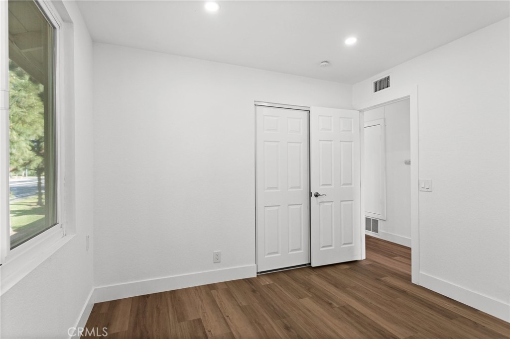16 Encina Irvine, CA 92620 - Photo 25 of 37 a view of an empty room with wooden floor and a window
