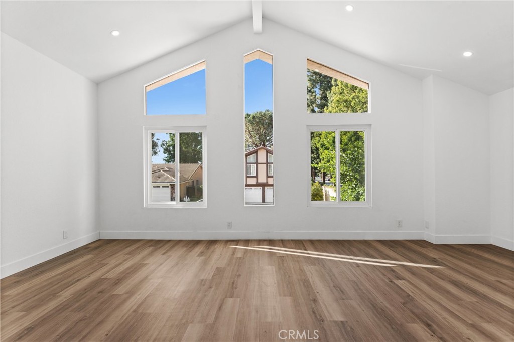 16 Encina Irvine, CA 92620 - Photo 26 of 37 a view of an empty room with wooden floor and a window
