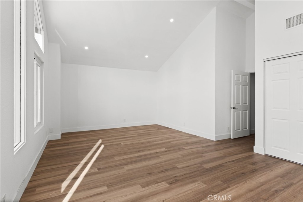 16 Encina Irvine, CA 92620 - Photo 27 of 37 a view of an empty room with wooden floor and a window