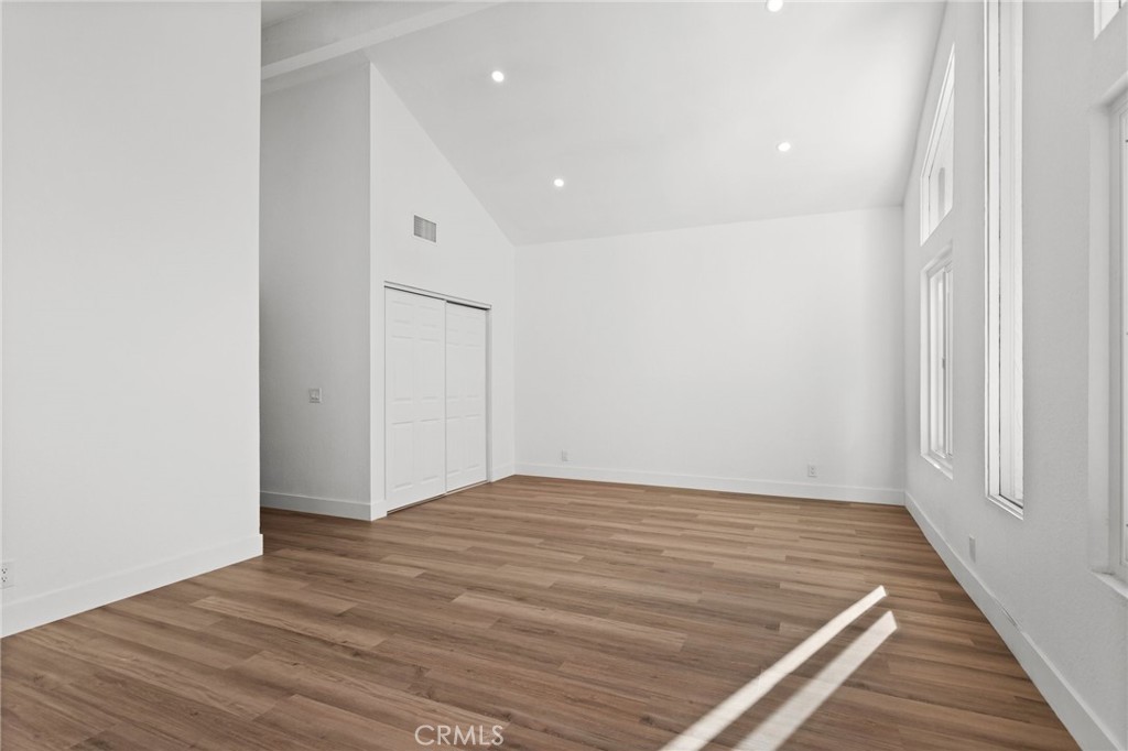 16 Encina Irvine, CA 92620 - Photo 28 of 37 a view of an empty room with wooden floor and a window