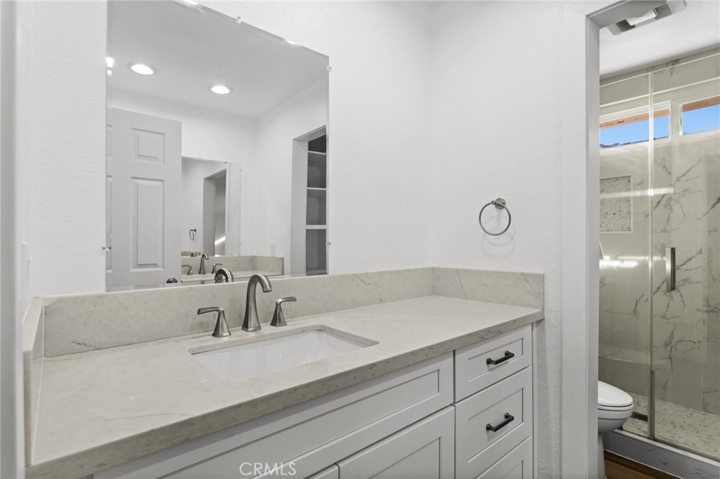 16 Encina Irvine, CA 92620 - Photo 29 of 37 a bathroom with a sink and a mirror