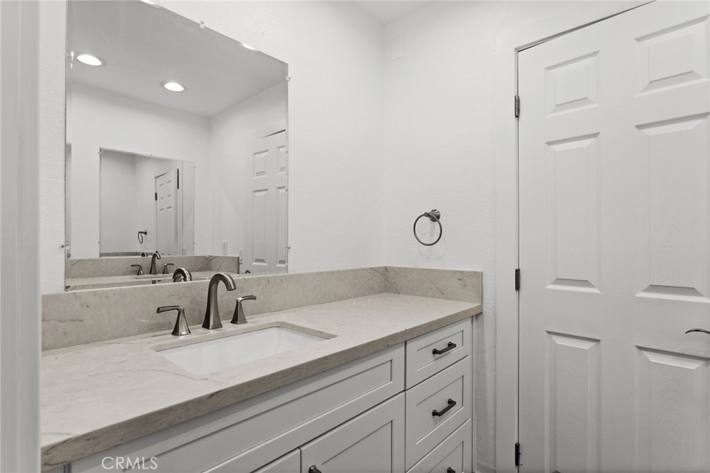16 Encina Irvine, CA 92620 - Photo 31 of 37 a bathroom with a sink and a mirror