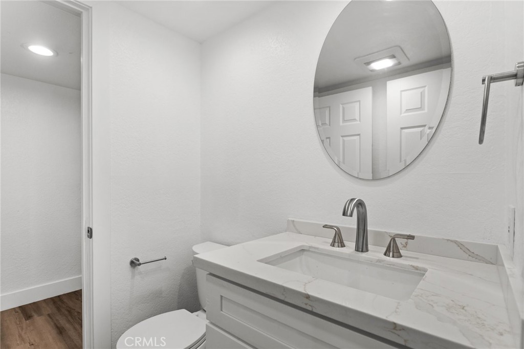 16 Encina Irvine, CA 92620 - Photo 35 of 37 a bathroom with a granite countertop sink mirror vanity and toilet