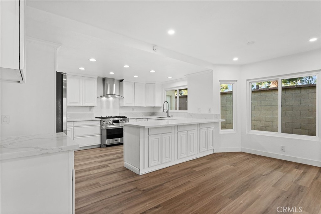 16 Encina Irvine, CA 92620 - Photo 4 of 37 a kitchen with a white wooden cabinets and white appliances