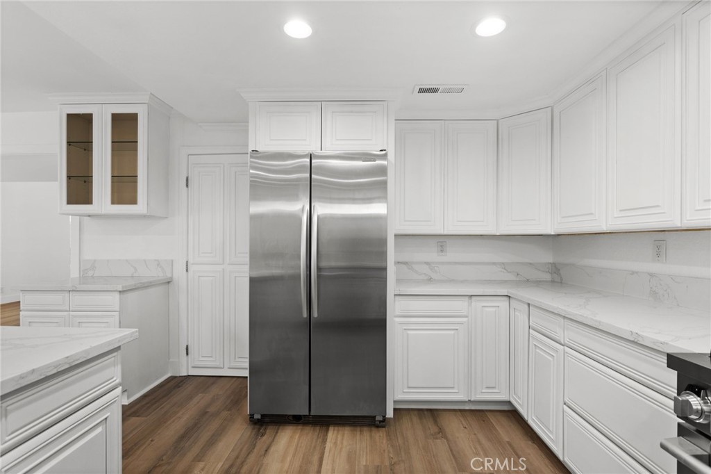 16 Encina Irvine, CA 92620 - Photo 5 of 37 a kitchen with a refrigerator and cabinets