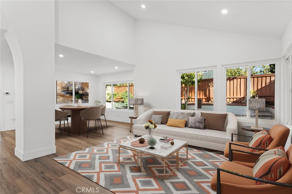 16 Encina Irvine, CA 92620 - Photo 7 of 37 a living room with furniture a rug and a table