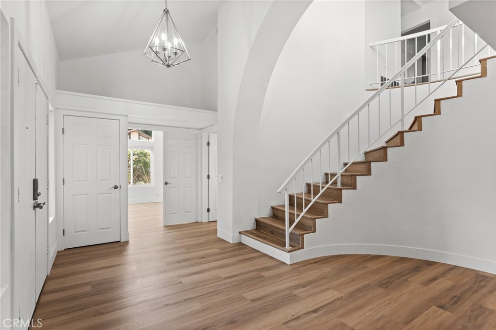 16 Encina Irvine, CA 92620 - Photo 9 of 37 a view of entryway and hall with wooden floor