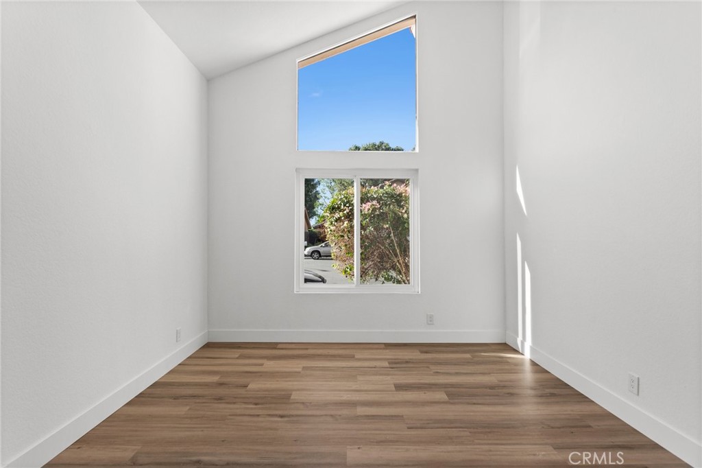 16 Encina Irvine, CA 92620 - Photo 10 of 37 a view of an empty room with wooden floor and a window