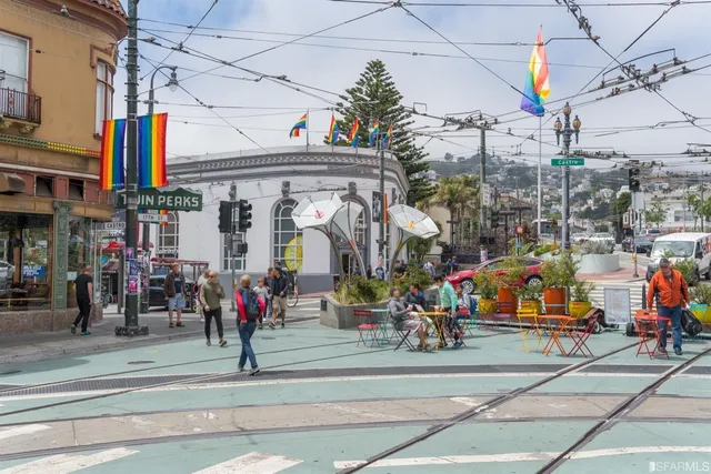 a view of path along with retail shop and buildings
