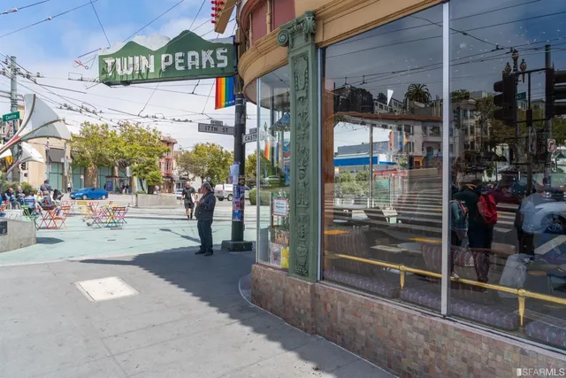 a view of a street with stores
