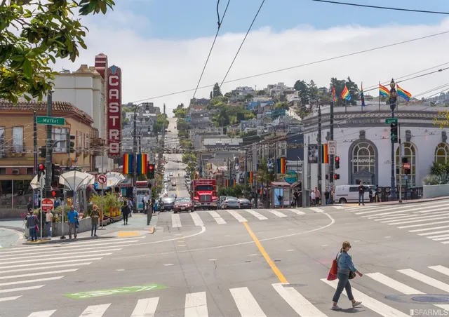 a view of a swimming pool with a yard and plants