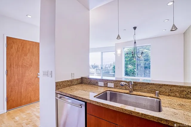 a kitchen with a sink and a window