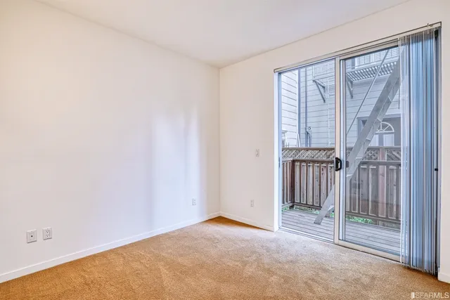 a view of empty room with floor to ceiling window