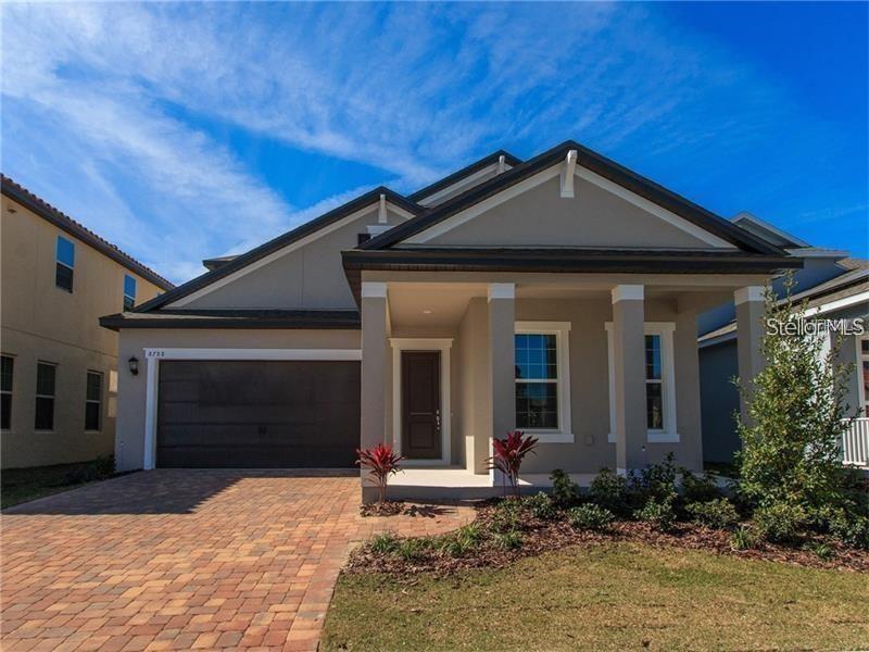 8788 Powder Ridge Trail Windermere, FL 34786 - Photo 1 of 1 a front view of a house with garden