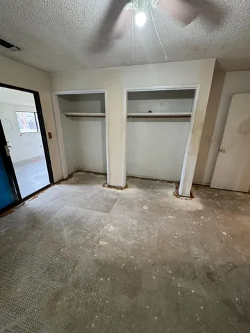 a view of an empty room with a fireplace