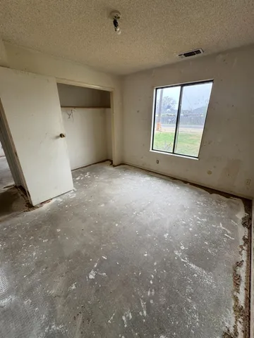 an empty room with windows