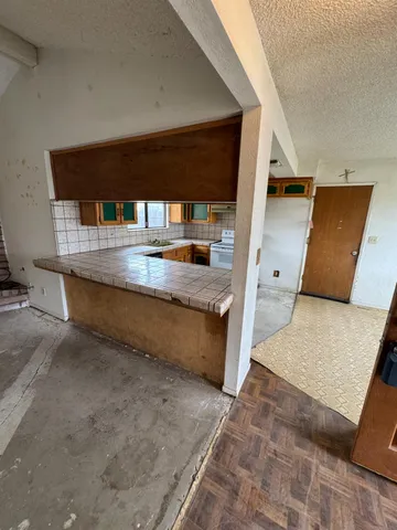 a view of a living room with a large window