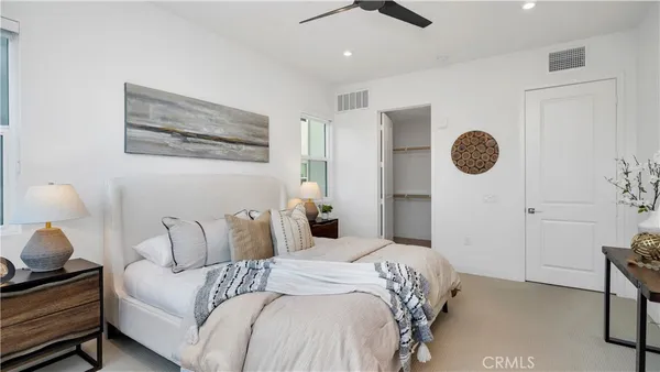 a bedroom with bed and a window
