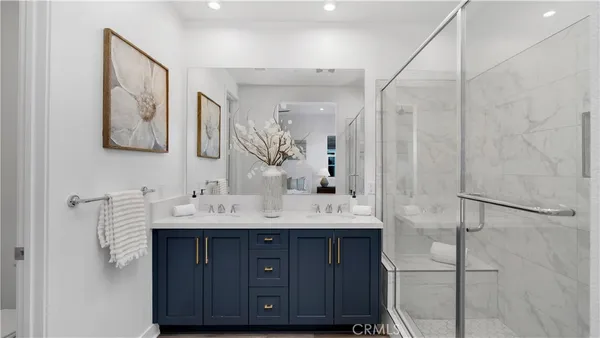 a bathroom with a double vanity sink mirror and double
