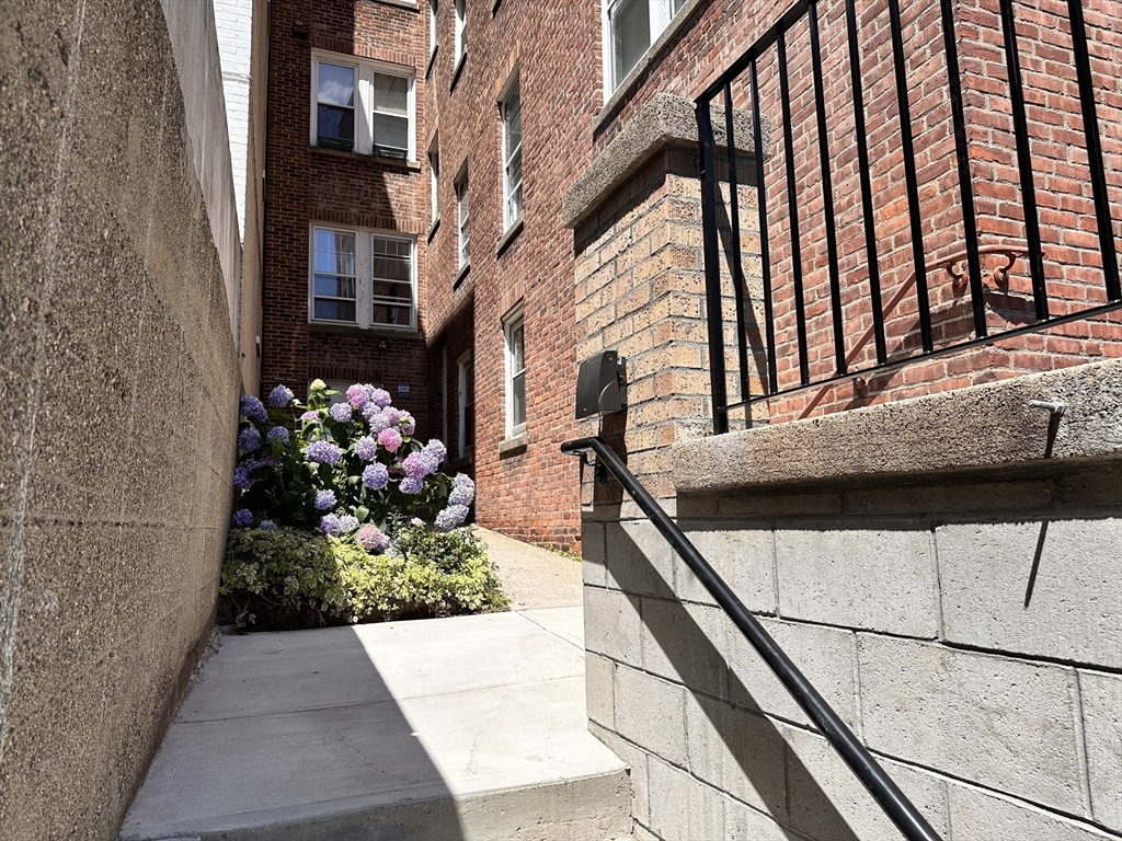 1521 Beacon Street, Unit 1 Brookline, MA 02446 - Photo 13 of 15 a view of a pathway along the path