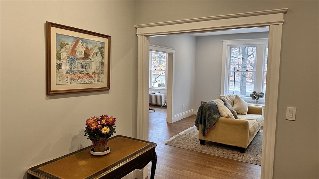1521 Beacon Street, Unit 1 Brookline, MA 02446 - Photo 4 of 15 a living room with furniture and wooden floor