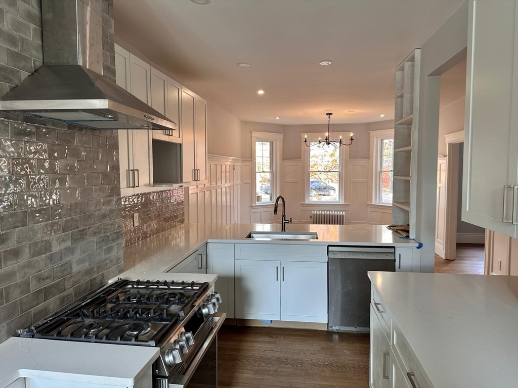 1521 Beacon Street, Unit 1 Brookline, MA 02446 - Photo 6 of 15 a kitchen that has a sink and a stove
