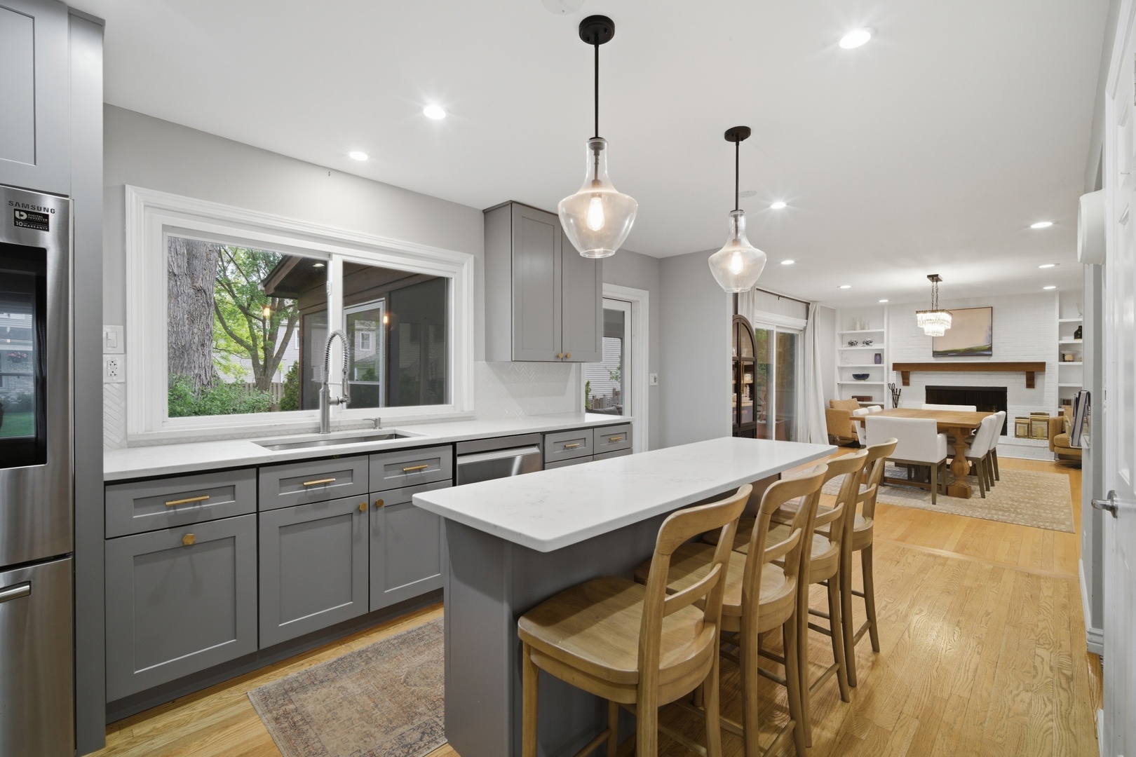 2831 Farmington Road Northbrook, IL 60062 - Photo 6 of 33 a large kitchen with kitchen island a large island in it